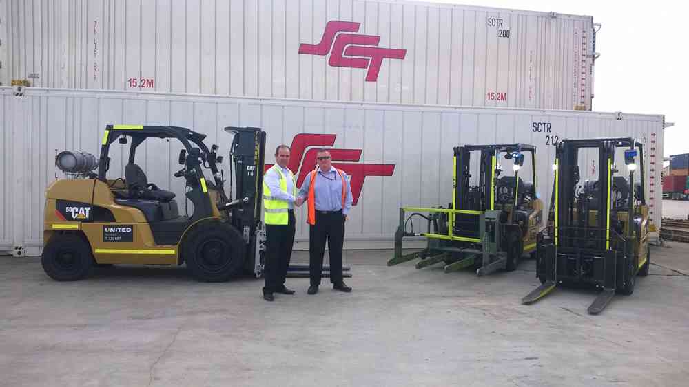 United Victorian State Manager, Brett Whelan, handing over Cat forklifts to SCT National Fleet Manager, Michael Sommers