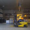 Cat 4-wheel electric forklift operating in cold storage